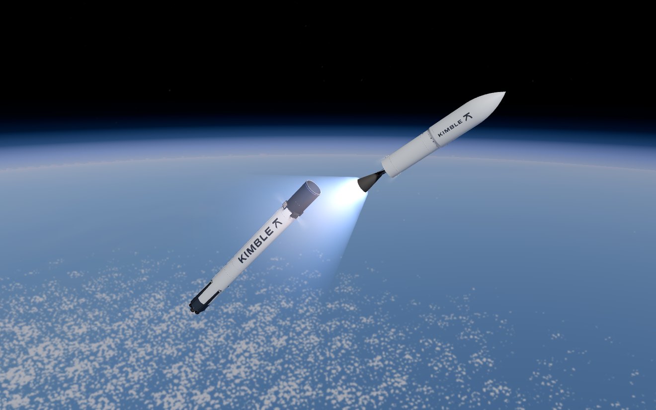 Rendered in the simulator: high above the Earth, the upper stage fires its engine as the spent booster falls away.